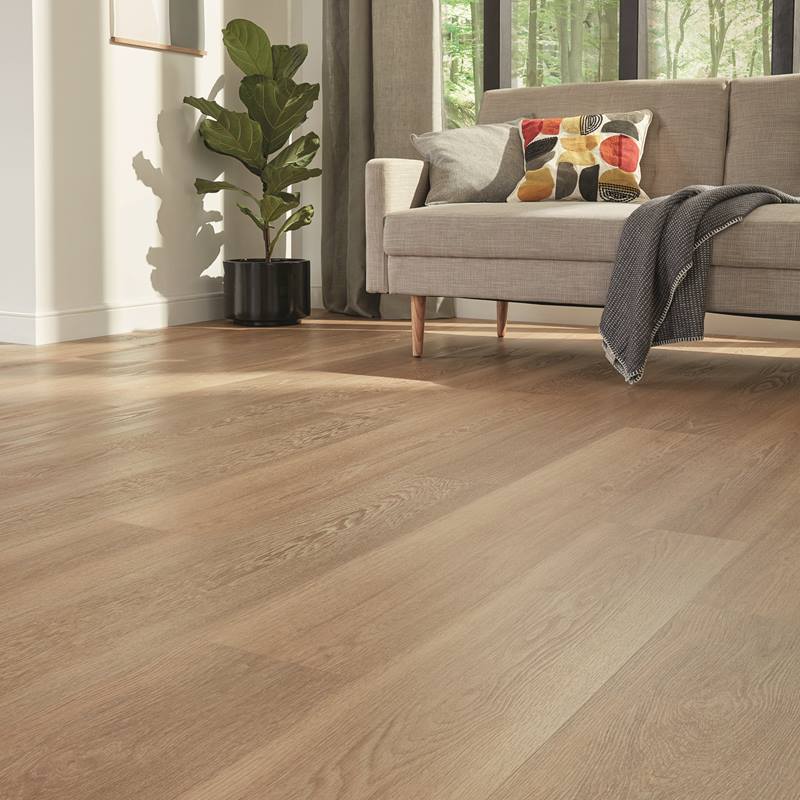 Warm luxury vinyl plank installed in kitchen and living area
